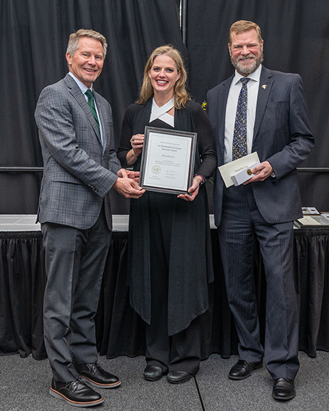Dr. Samantha Cass with President Guskiewicz and Interim Provost Jeitsckho