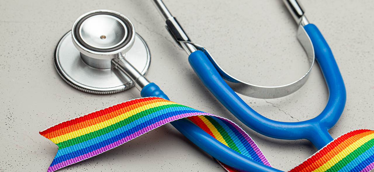 pride ribbon wrapped around stethoscope