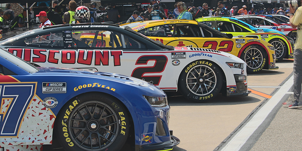 Cup Series cars await their turn for the pole race to determine race placement