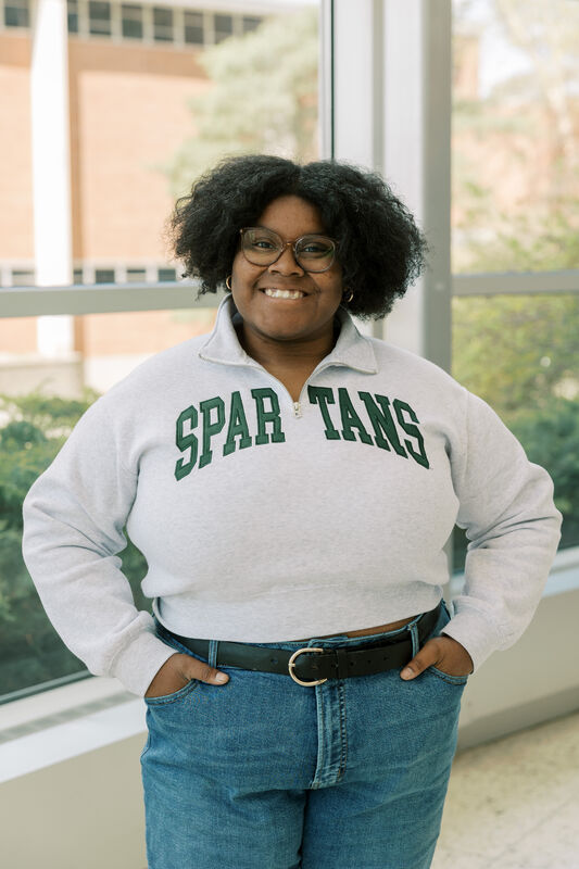 Kailyn Butler wears a Spartans sweatshirt