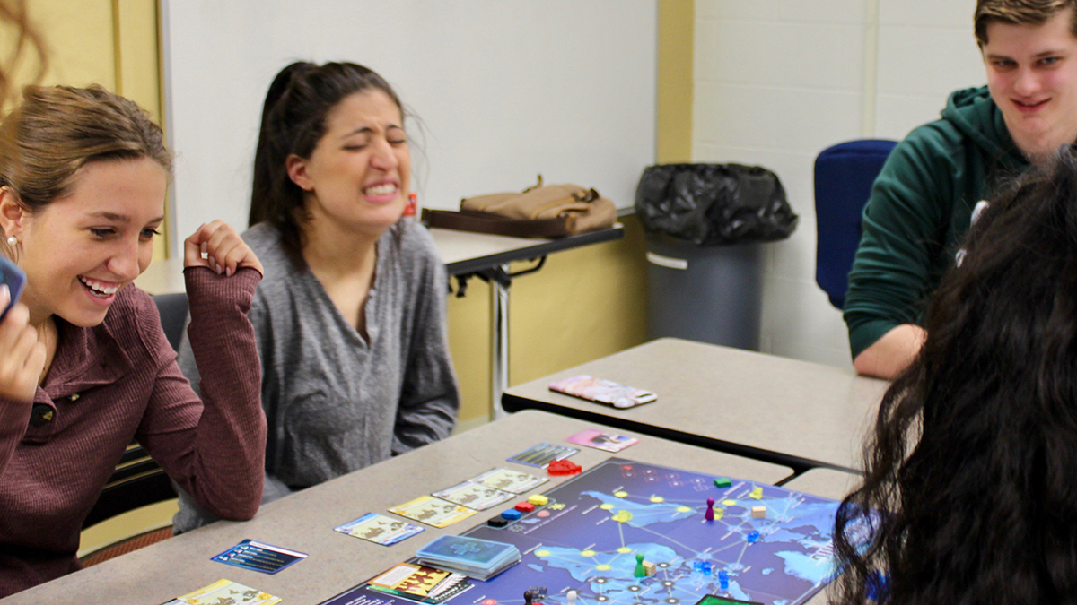Students laughing playing a game