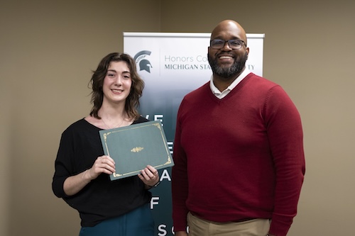 First-Place winner Emma Knott with Glenn Chambers, interim dean of the Honors College and RCAH