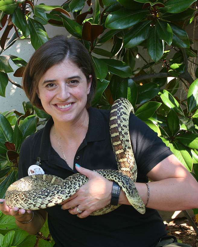 Sarah Navarro holds a snake