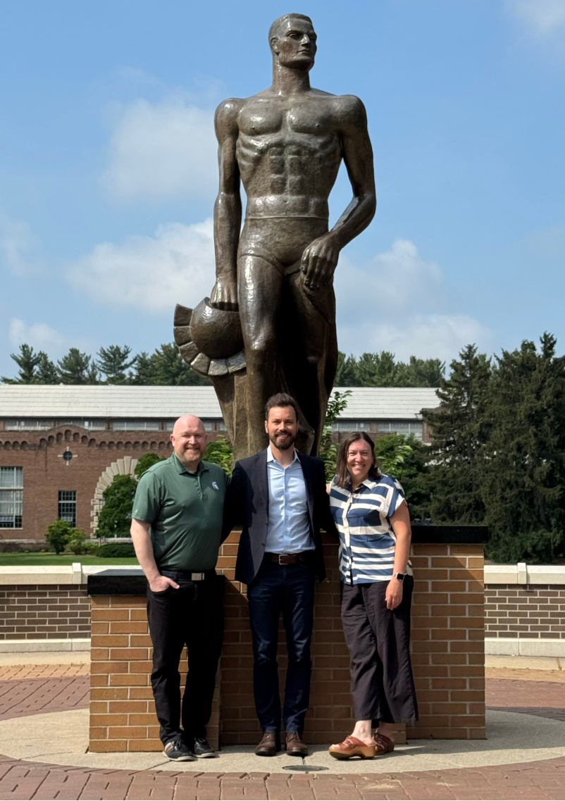 Photo of Joe Schroeter (center) with Director of Alumni Venture Support, Entrepreneurship & Innovation, Sean Foctman and Dean Kendra Cheruvelil  