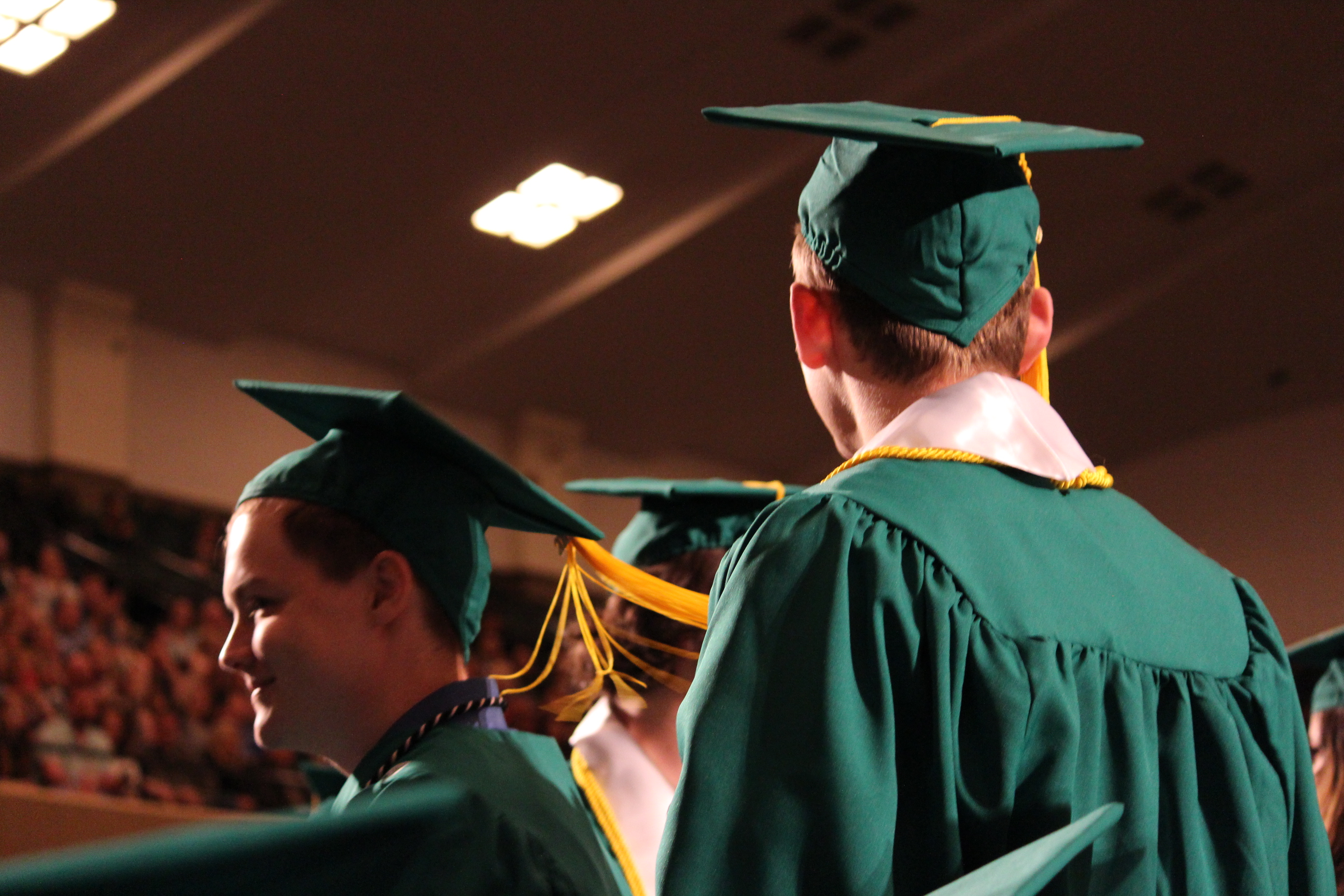 Students stand up and are honored at the Spring 2019 commencement