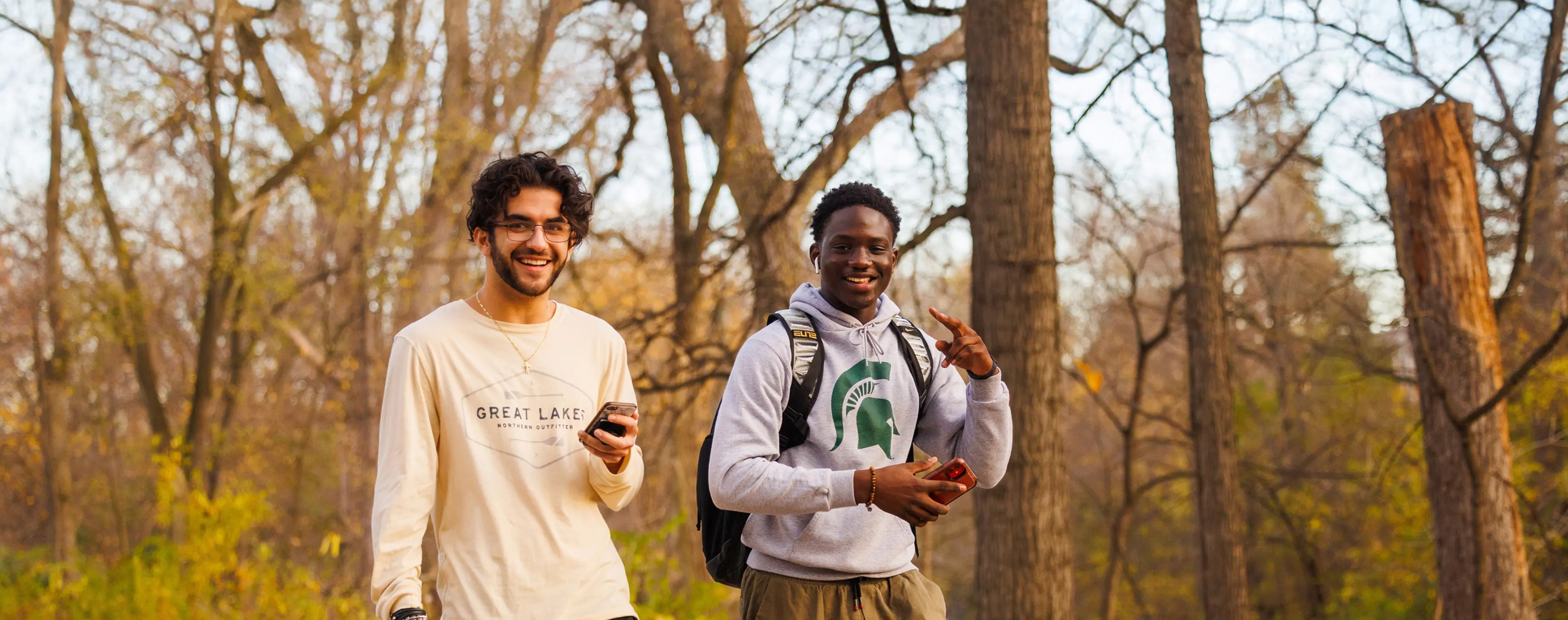 Students walking outside on campus during fall