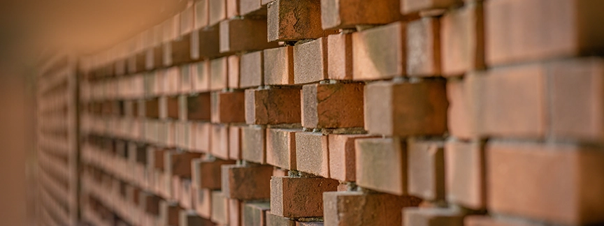detail of midcentury brick wall outside Holmes Hall