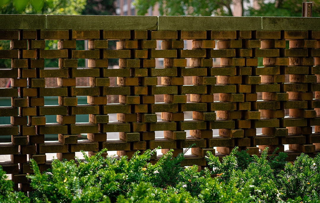 midcentury modern brick wall outside Holmes Hall
