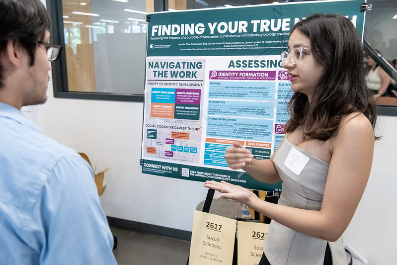 A student presents research at a conference