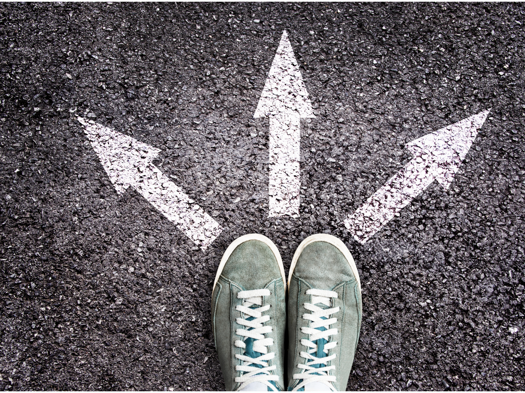 Shoes on pavement. Three arrows pointing in different directions