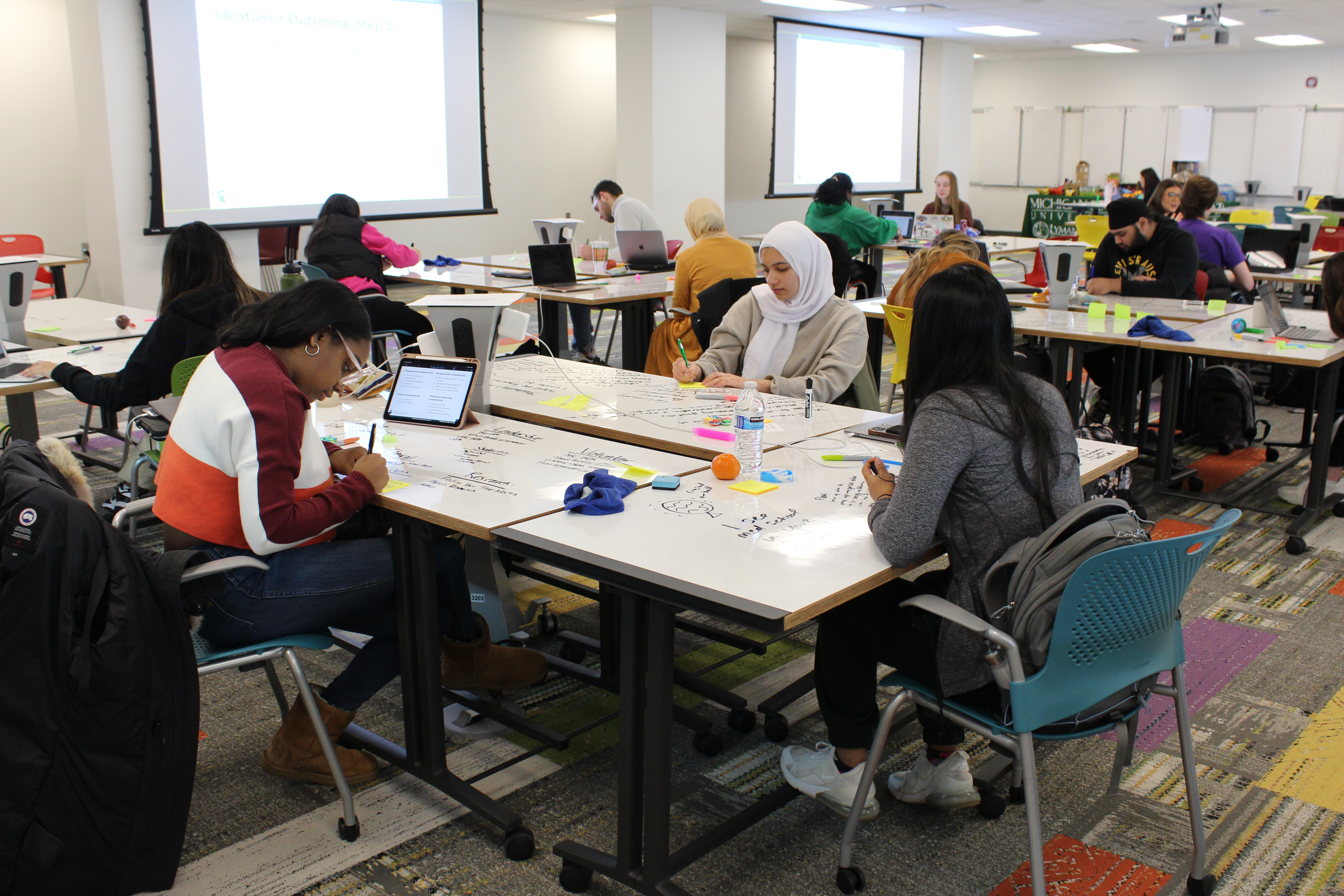 students work on personal statements at a past workshop