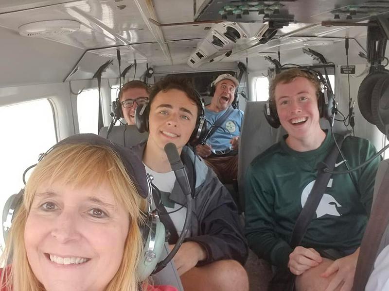 Hanni, students, and Steve, in a helicopter over Fraser Island, Australia