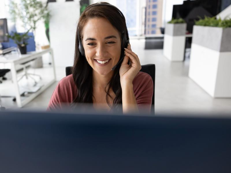 a smiling person has a conversation with another