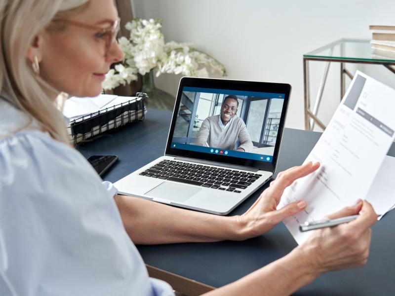 a person interviews another over zoom