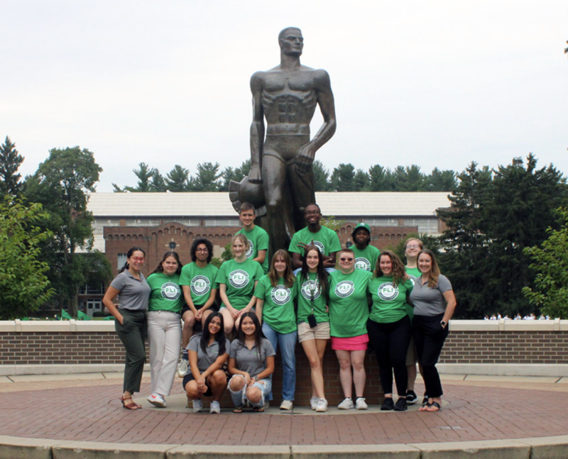 FLI Vanderploeg Scholars and leaders pose by the Sparty statue