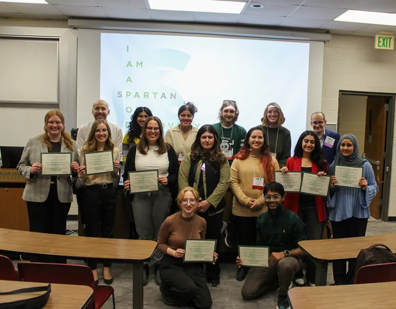 alumni volunteers with student winners of the 2025 LBC Research Showcase
