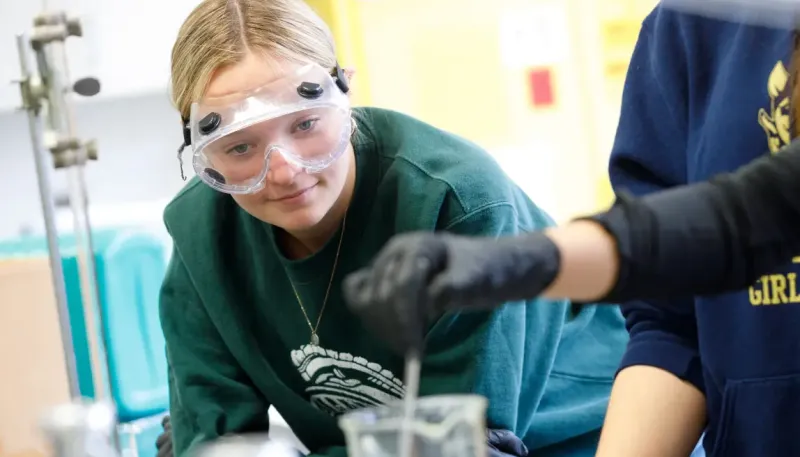 Student wearing safety glasses in a lab