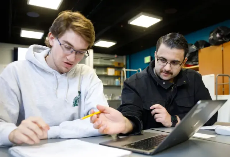 Students working together on a laptop