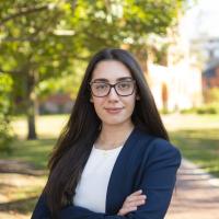 Sarah Krikor, third-year LBC student, wears a blue blazer and white top and smiles at the camera.