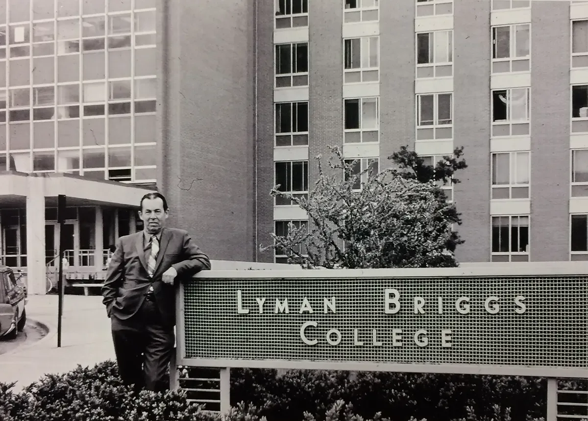 Dr. Frederic B. Dutton, the first dean of Lyman Briggs College, pictured in 1967 outside West Holmes Hall